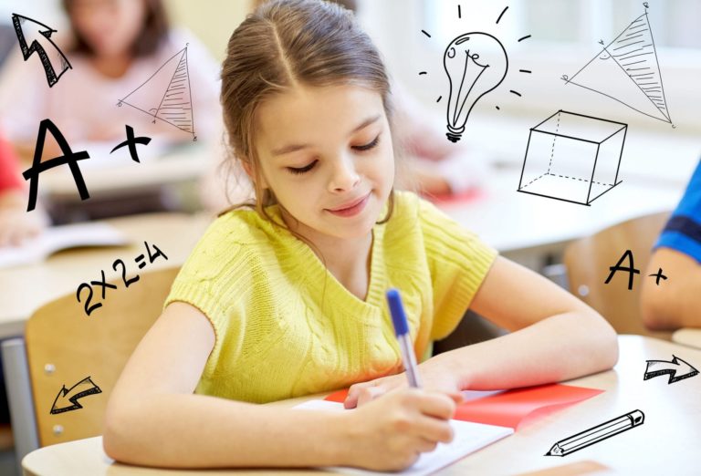 Young girl writing math in a notebook. IB Math and AP Calculus tutoring center in Seattle, Vancouver and Toronto