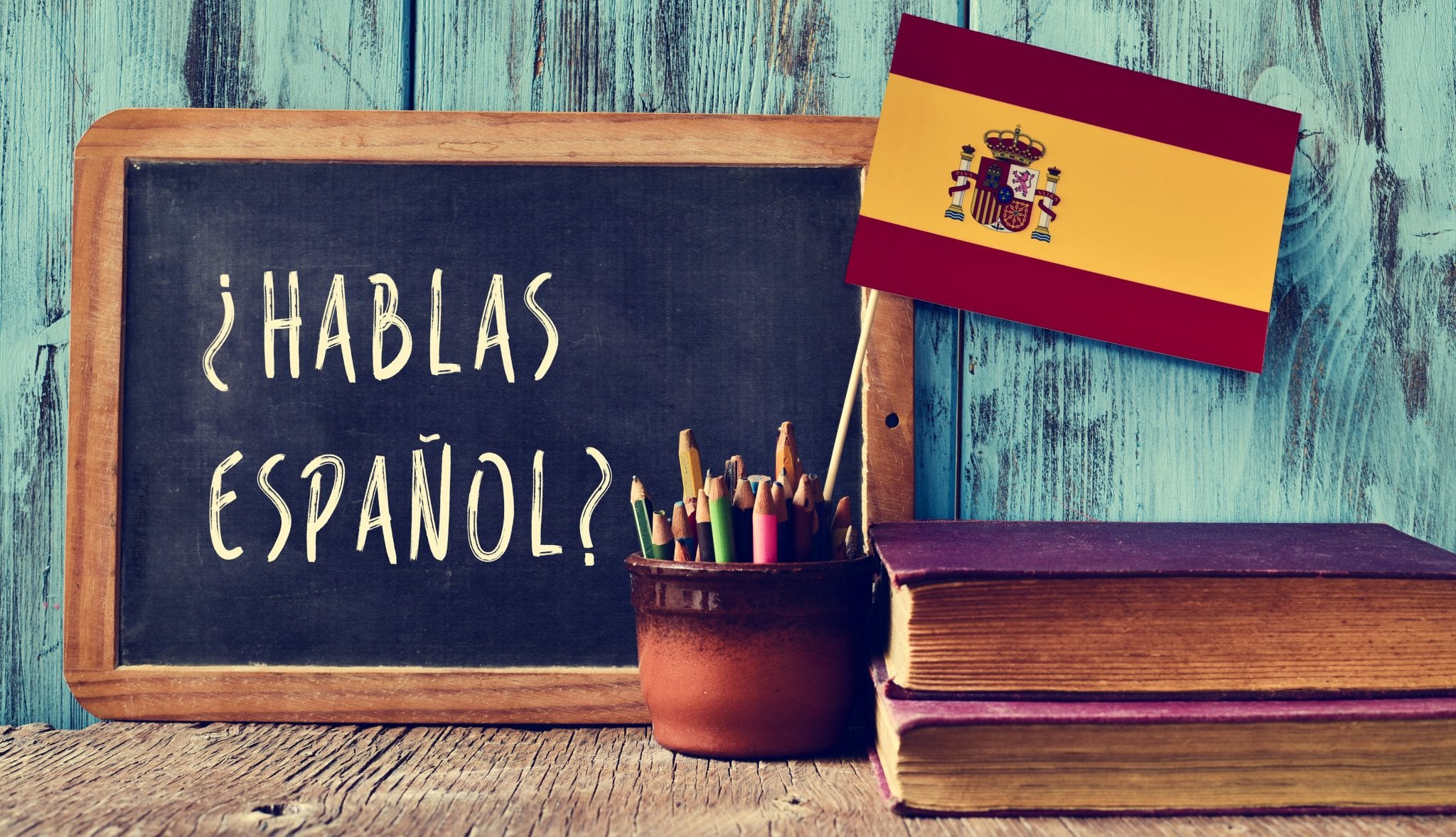 Blackboard with "Can you speak Spanish" on it and Spanish Flag. Hack your course Spanish tutoring service in West Vancouver